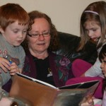 Irvina reading with children at A Quiet Forest Daycare and Preschool in Duvall, WA.