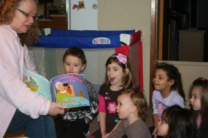 Irvina reading with children at A Quiet Forest Daycare and Preschool in Duvall, WA.