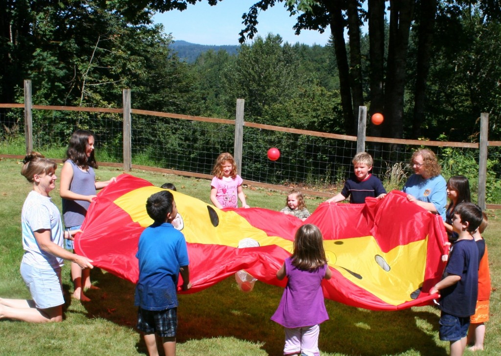 Children playing with Irvina at A Quiet Forest Daycare and Preschool in Duvall, WA