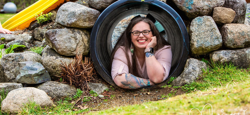 Meredith smiling from inside a tunnel